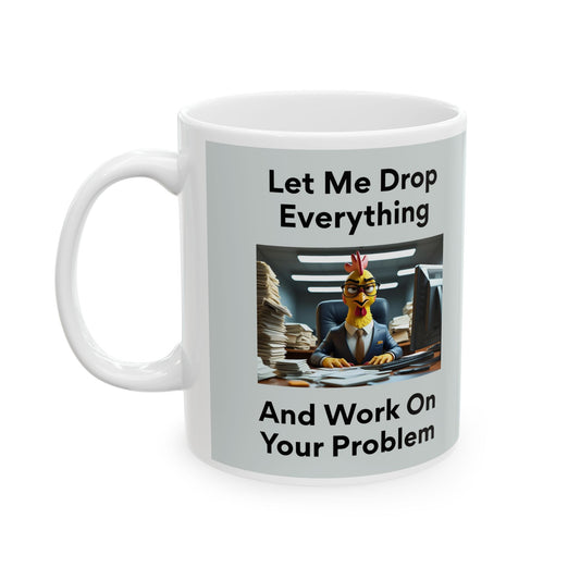 Let Me Drop Everything Mug with a cartoon chicken in a suit at a desk and text 