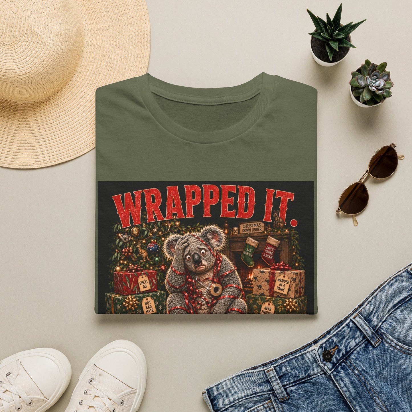 Folded Wrapped It. Regretted It. Koala Christmas T-Shirt in military green showing funny Australian Christmas artwork.