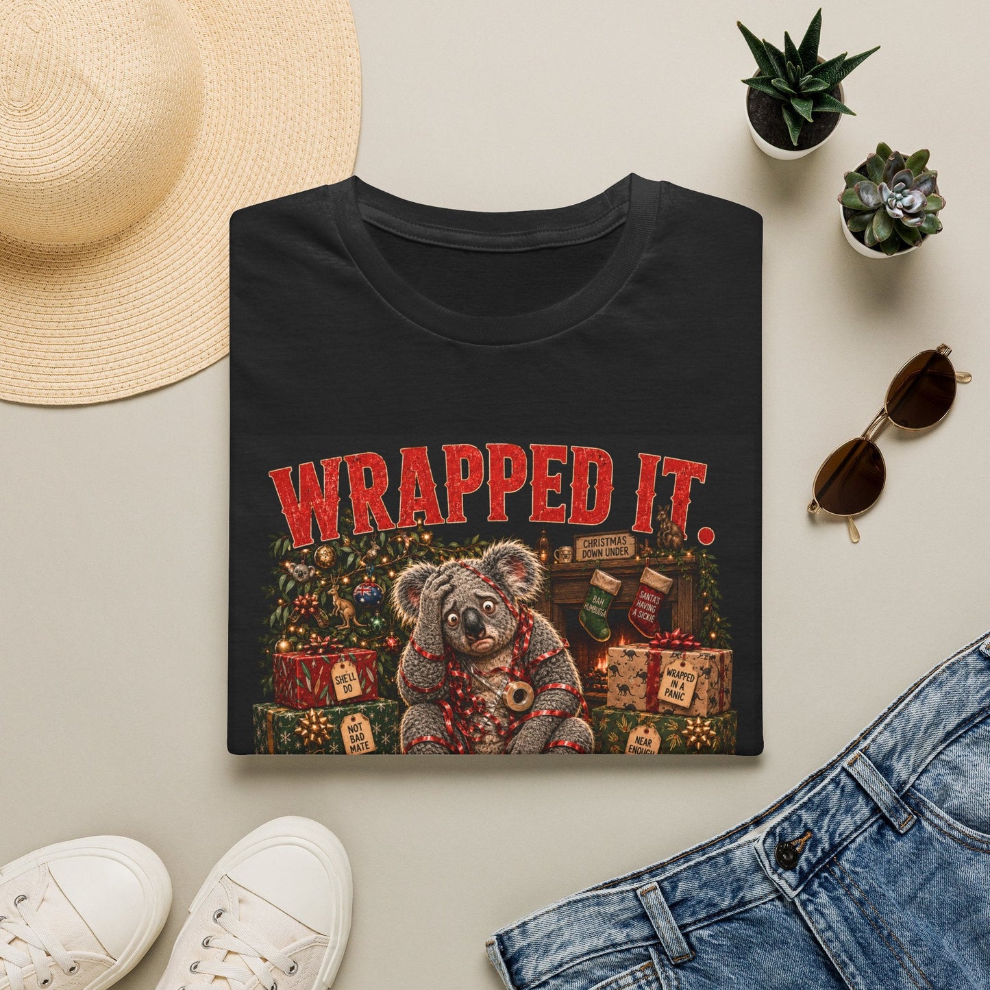 Folded Wrapped It. Regretted It. Koala Christmas T-Shirt in black showing funny Australian Christmas artwork.