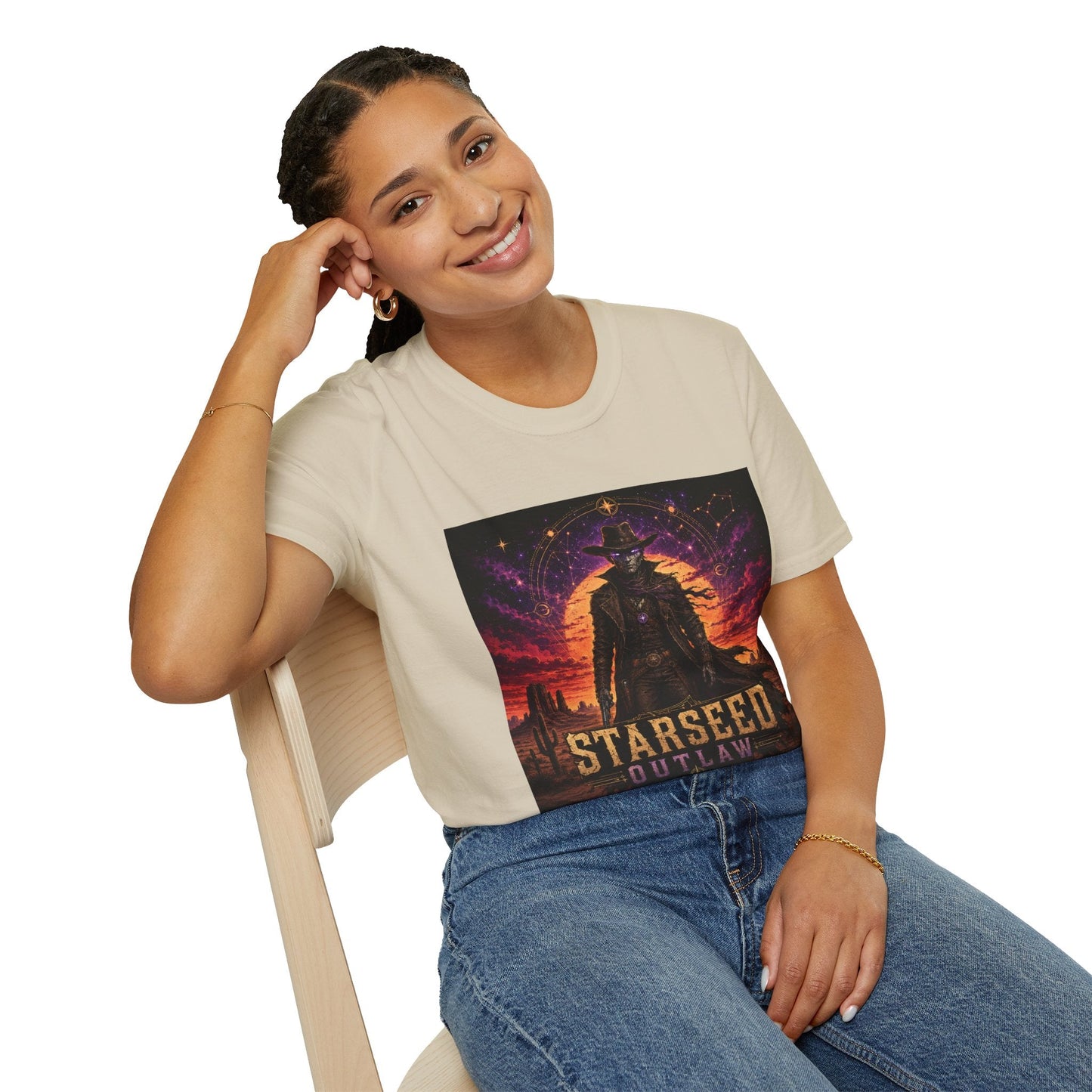 Model wearing Starseed Outlaw graphic T-shirt in natural with sci-fi alien outlaw design.