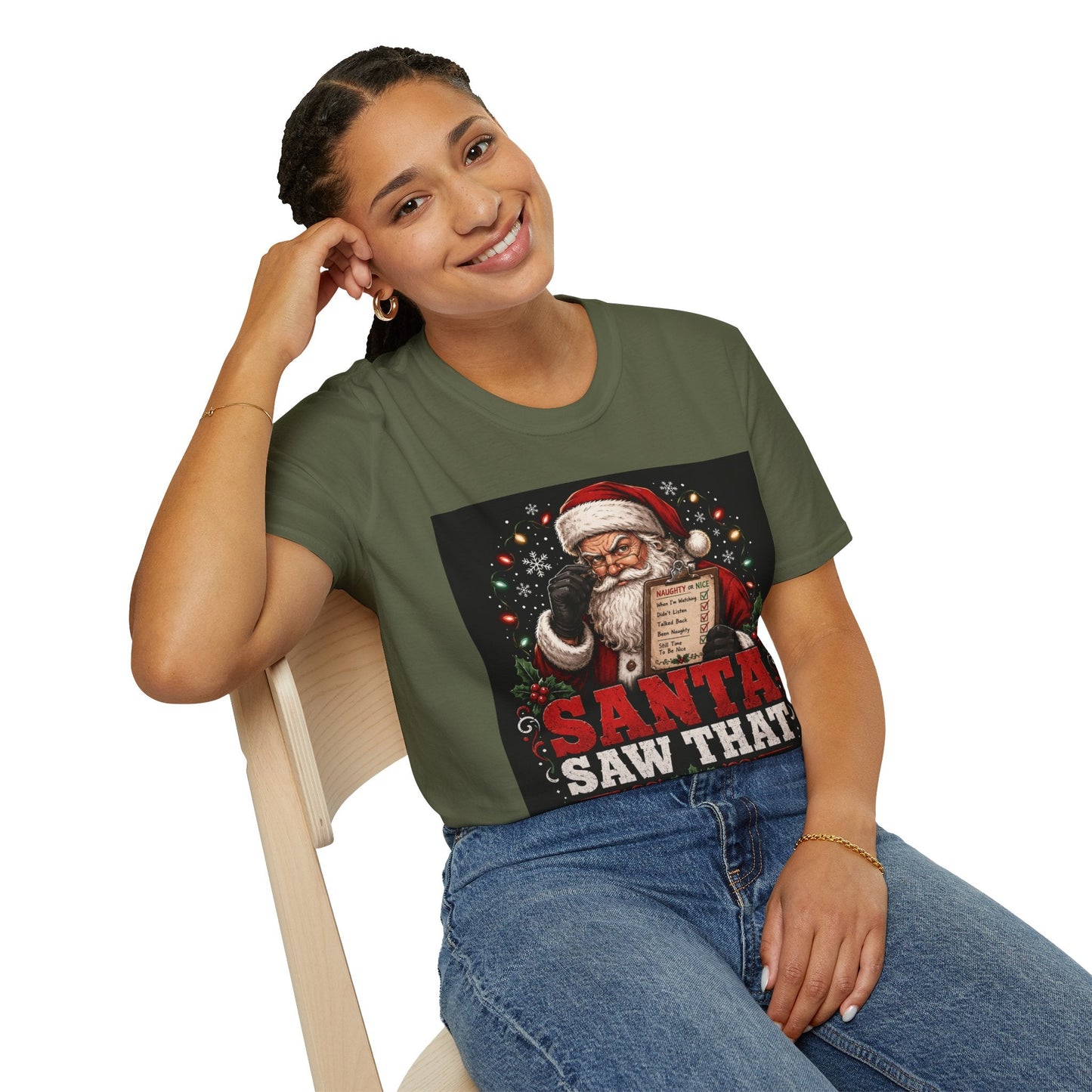 Model wearing the Santa Saw That Christmas T-Shirt in military green with funny Santa naughty list artwork.
