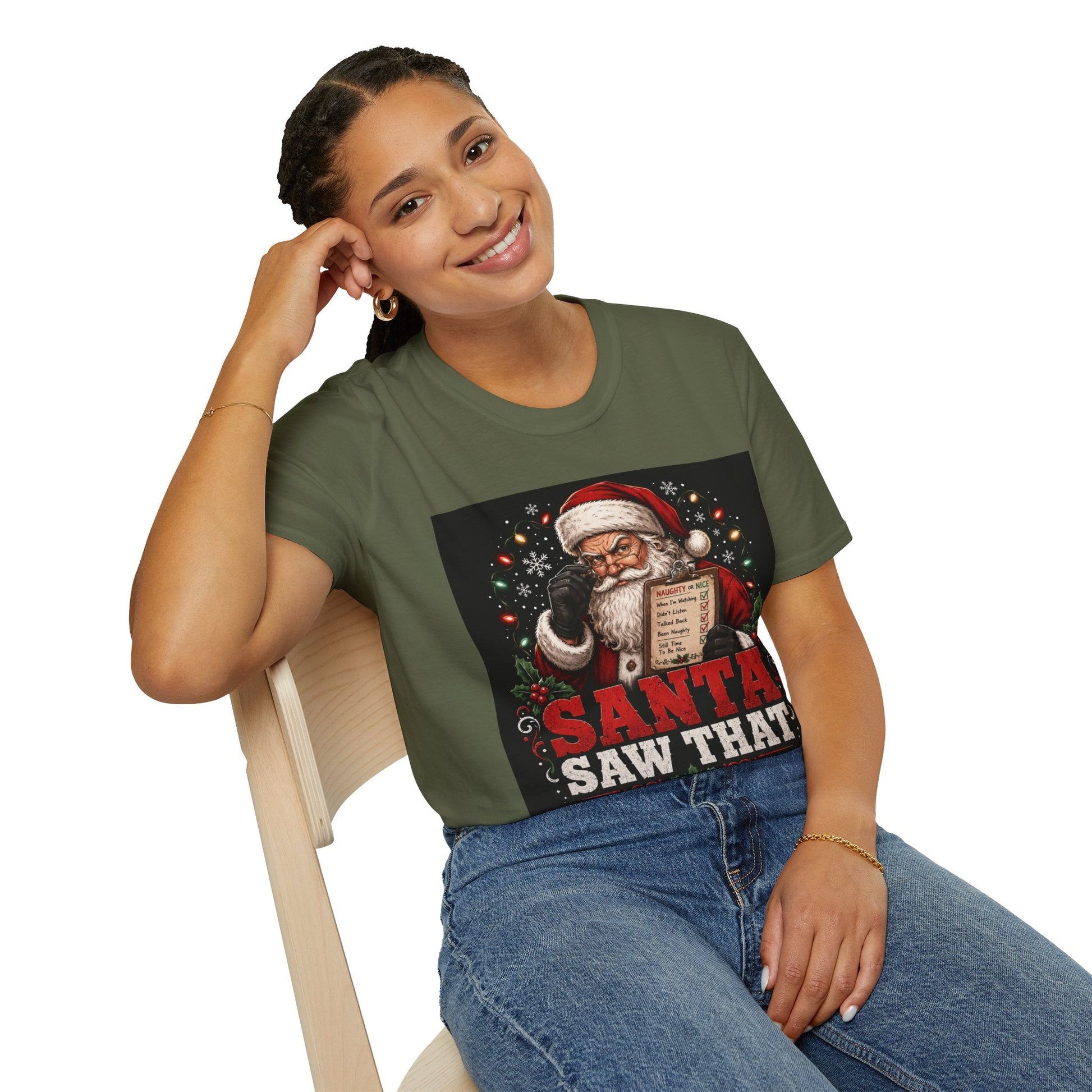 Model wearing the Santa Saw That Christmas T-Shirt in military green with funny Santa naughty list artwork.