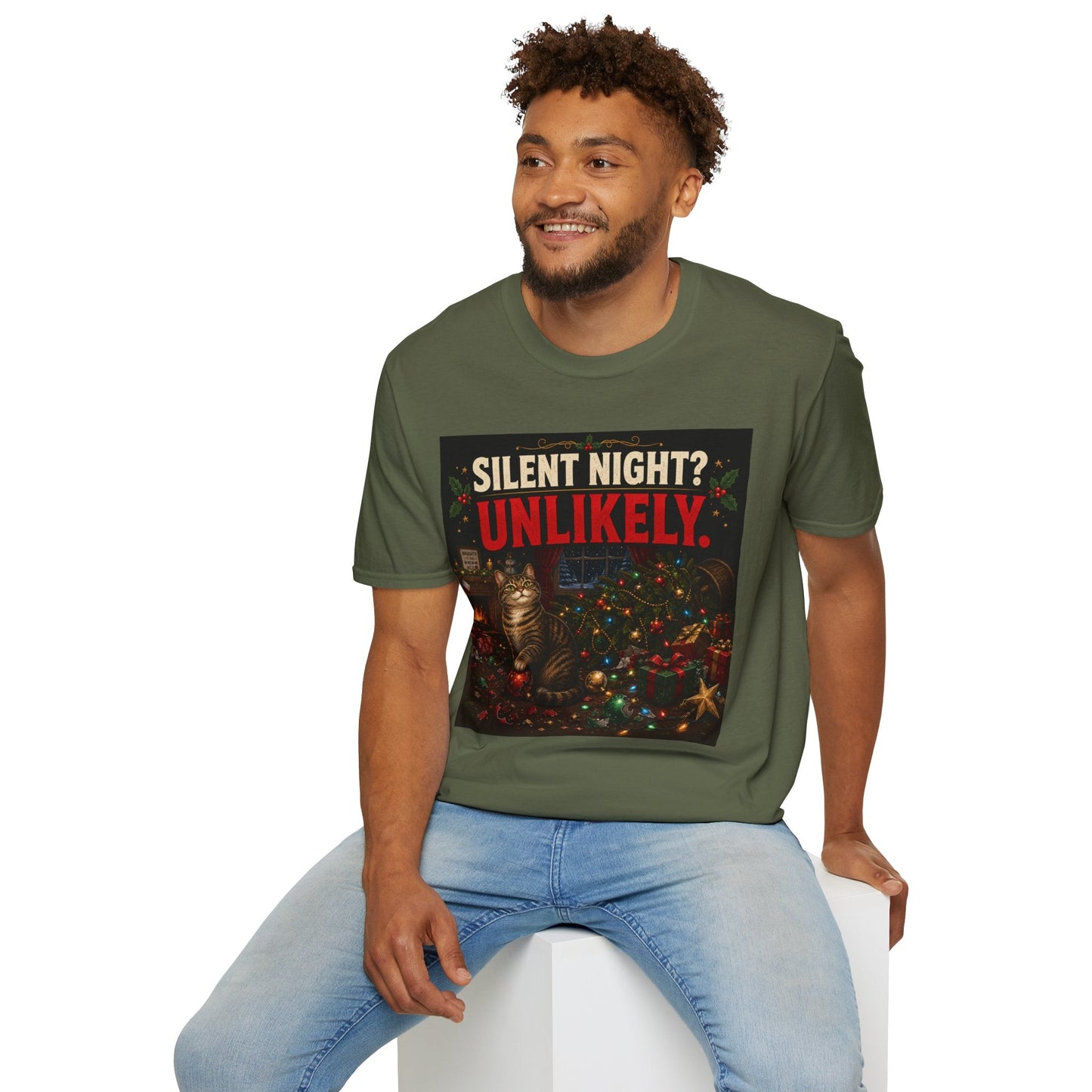Model wearing the Silent Night? Unlikely. Cat Christmas T-Shirt in military green with funny destroyed Christmas tree artwork.