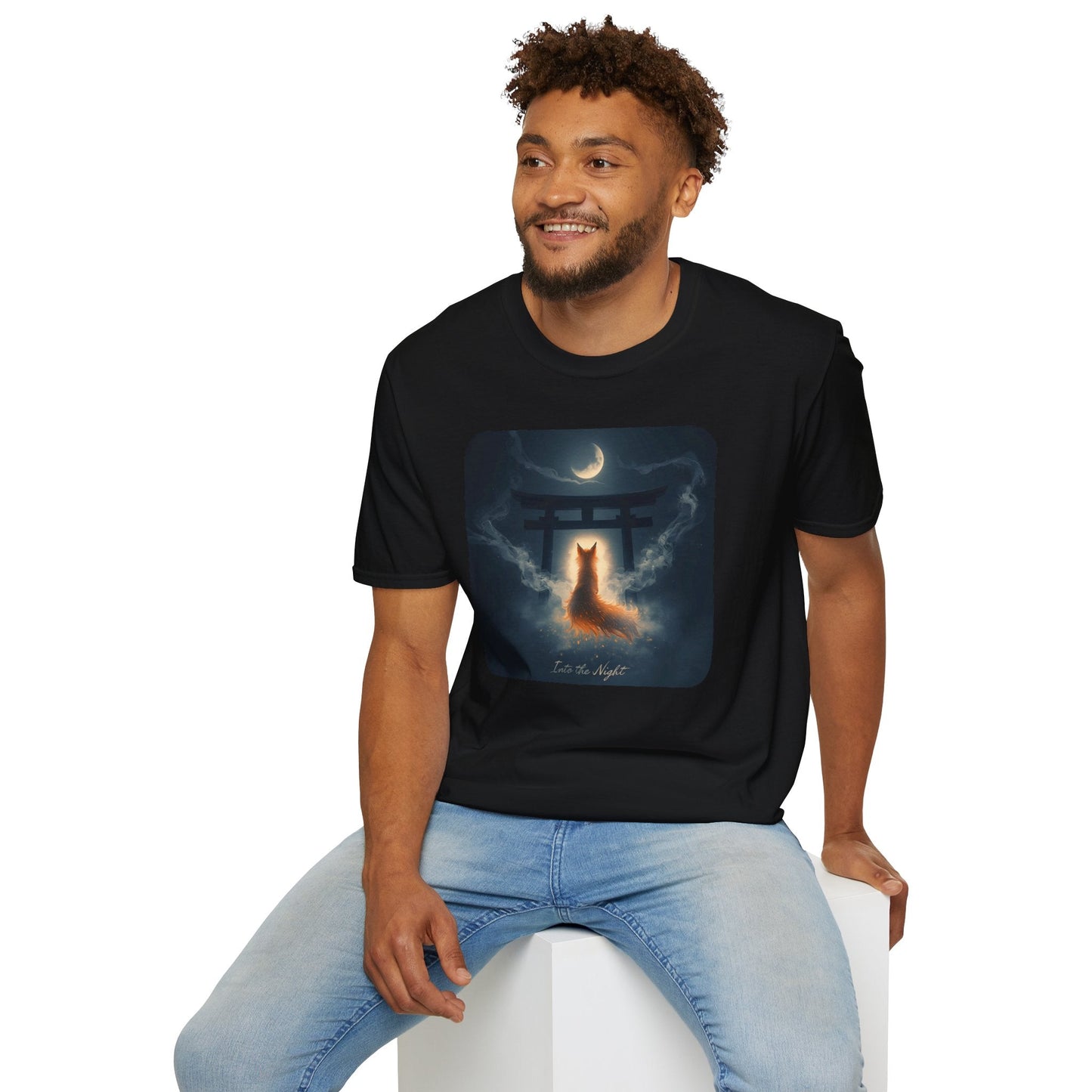 Model wearing the Into the Night Mystic Fox at the Torii T-Shirt in black featuring a glowing fox spirit beneath a torii gate and crescent moon.