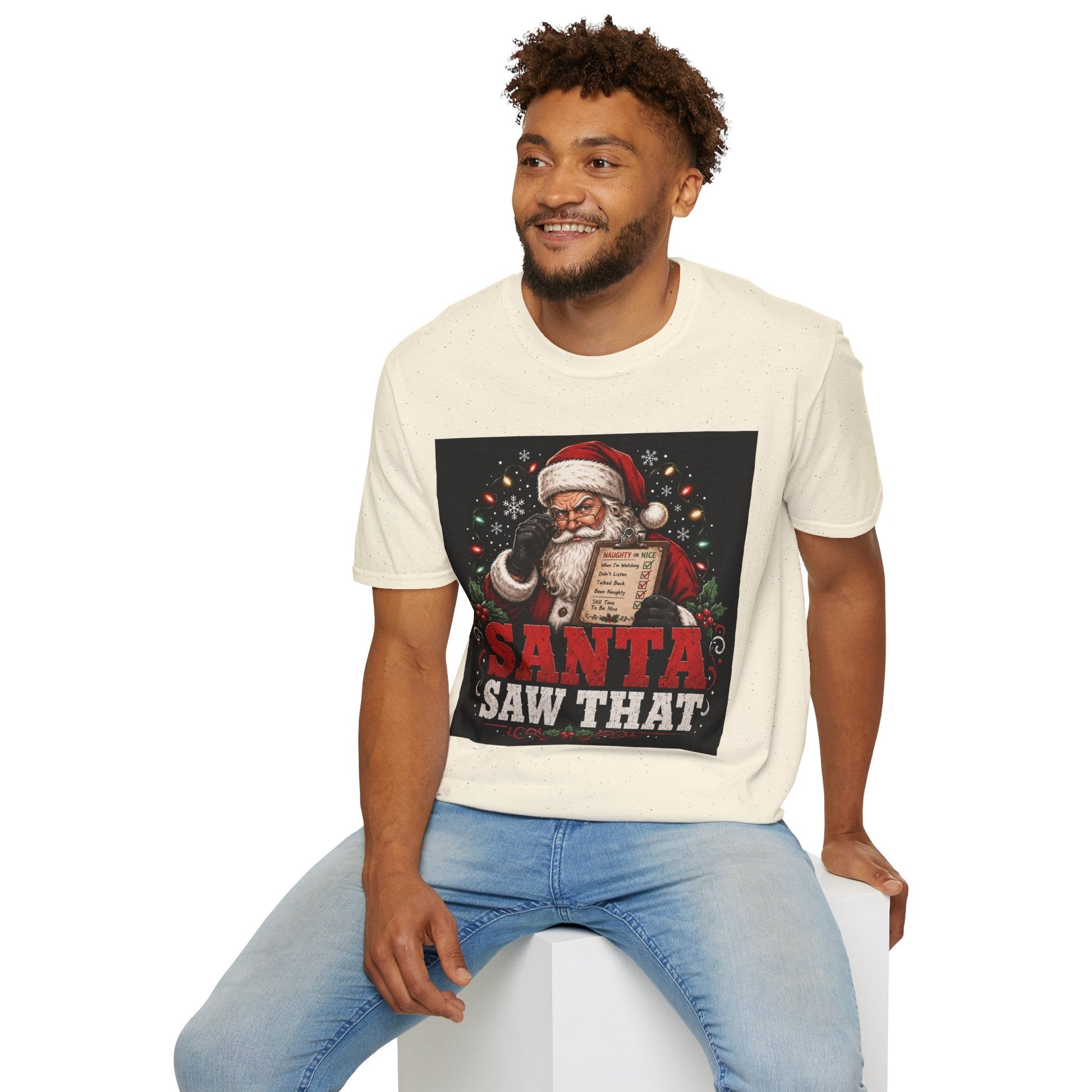Model wearing the Santa Saw That Christmas T-Shirt in natural with funny Santa naughty list artwork.