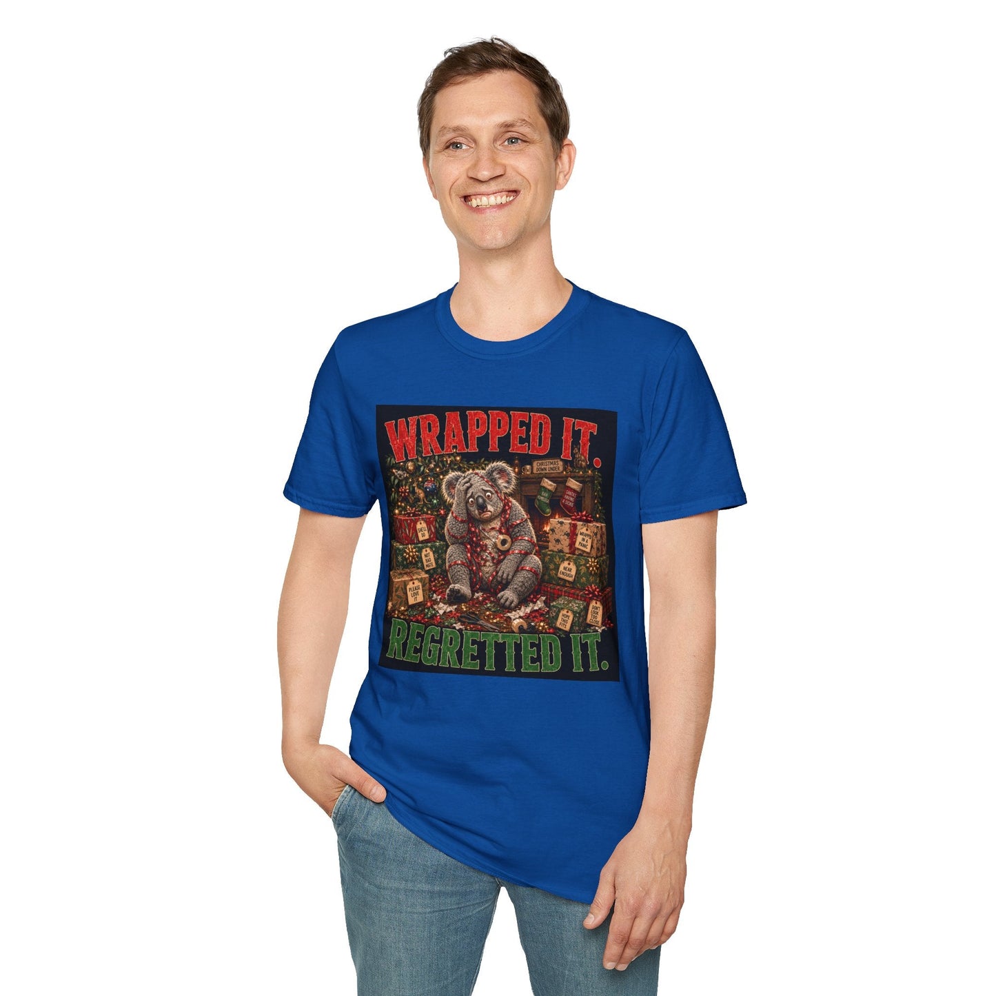 Model wearing the Wrapped It. Regretted It. Koala Christmas T-Shirt in royal, with funny festive koala artwork.