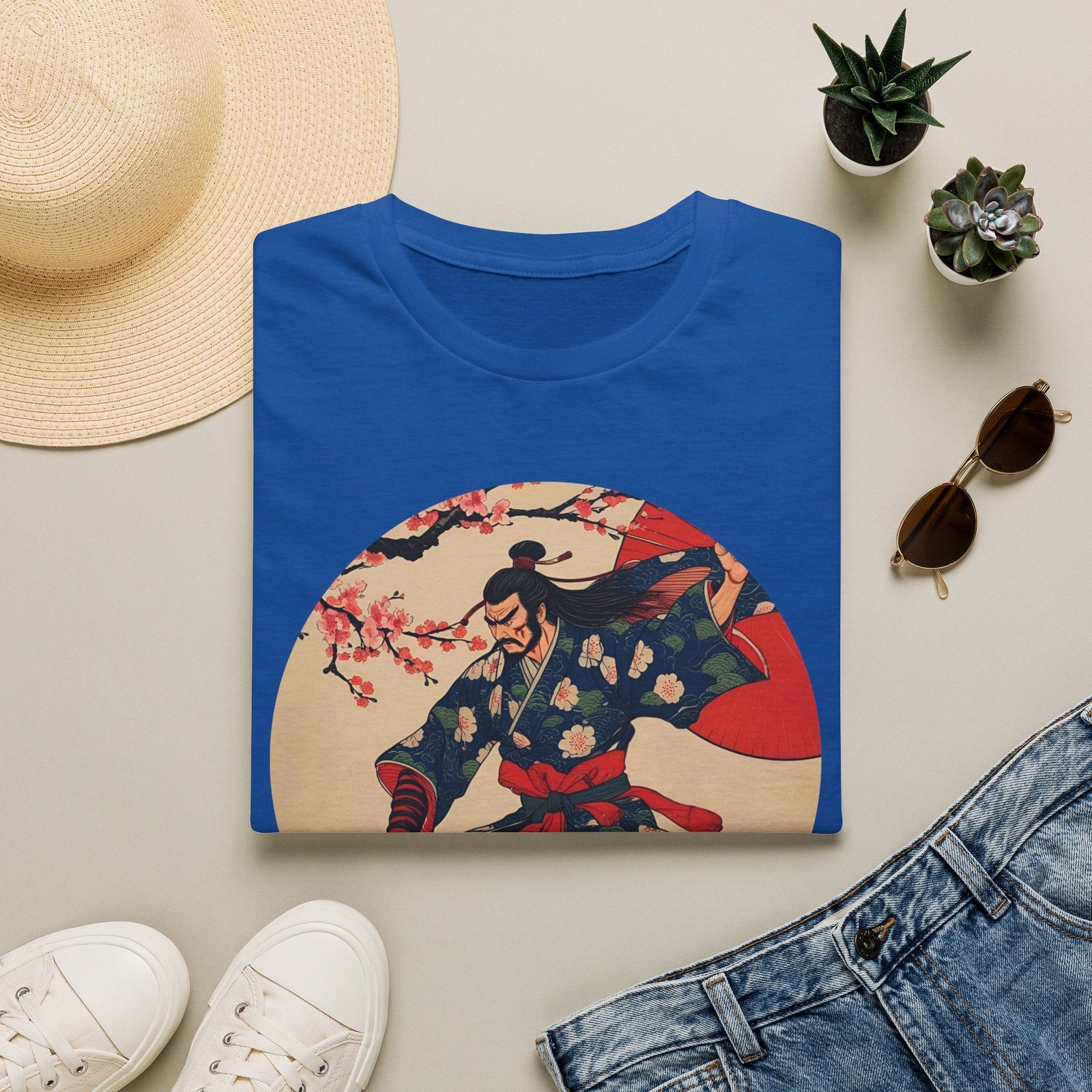 Folded Crimson Bloom Ronin Samurai Warrior T-Shirt in royal showing vintage-style samurai artwork with cherry blossoms, red parasol and dynamic warrior pose.
