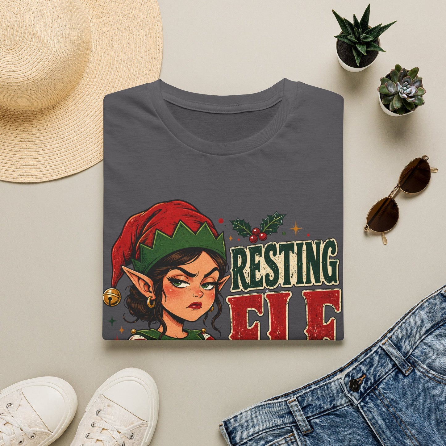Folded Resting Elf Face Sassy Elf Christmas T-Shirt in charcoal showing bold festive elf design.