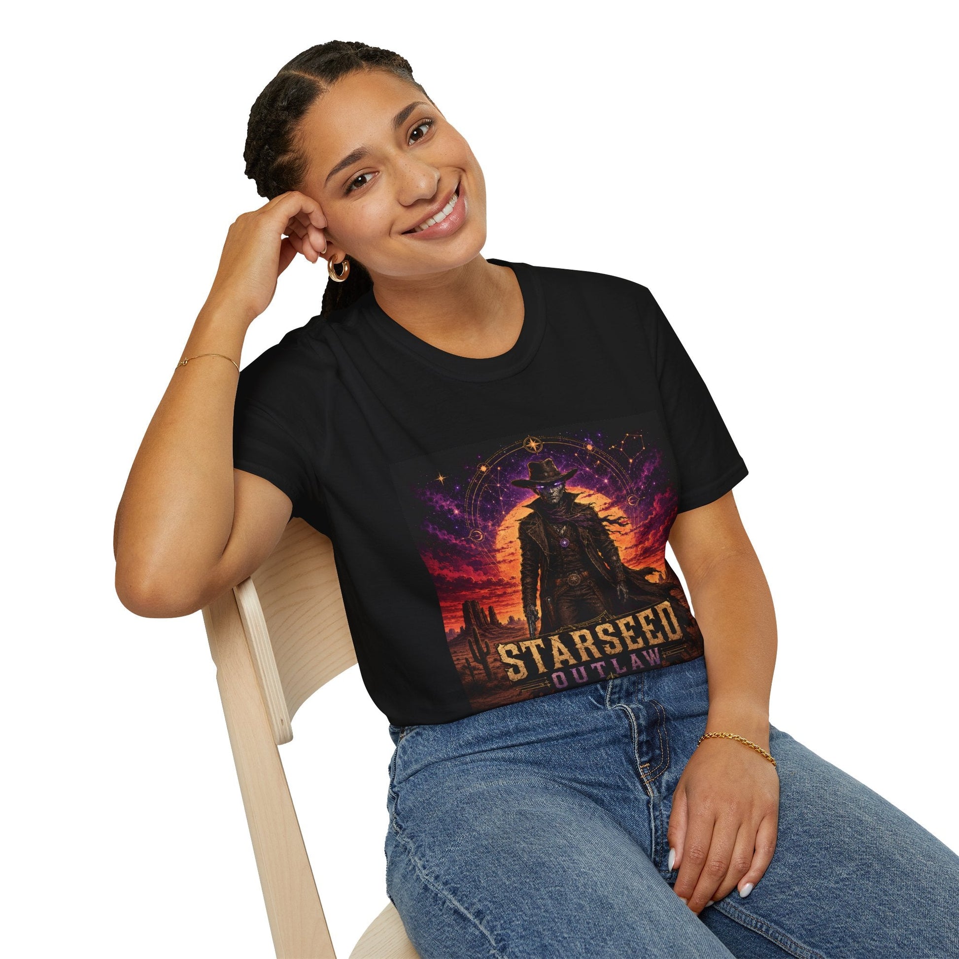 Model wearing Starseed Outlaw graphic T-shirt in black with sci-fi alien outlaw design.