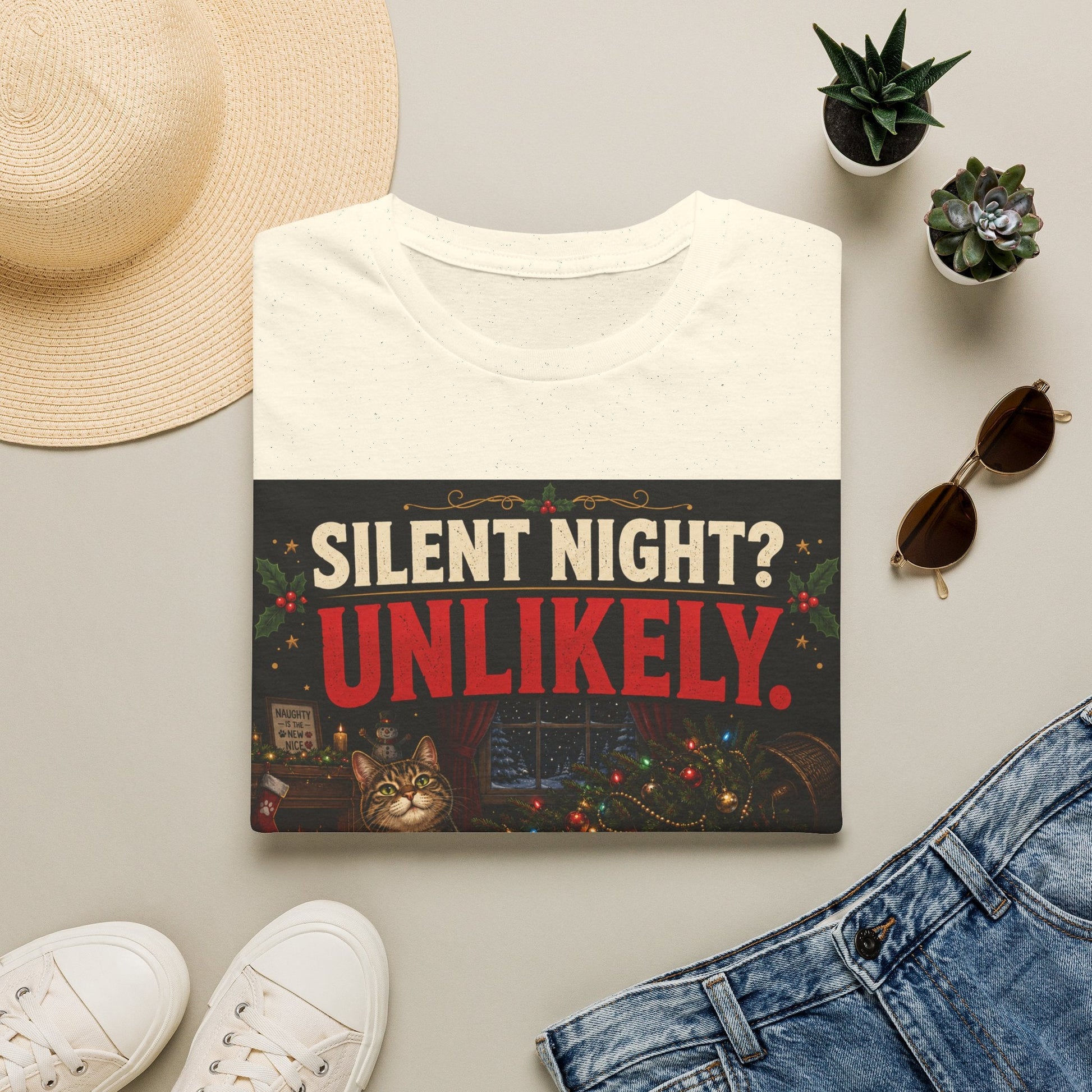 Folded Silent Night? Unlikely. Cat Christmas T-Shirt in natural showing a funny cat Christmas chaos design.
