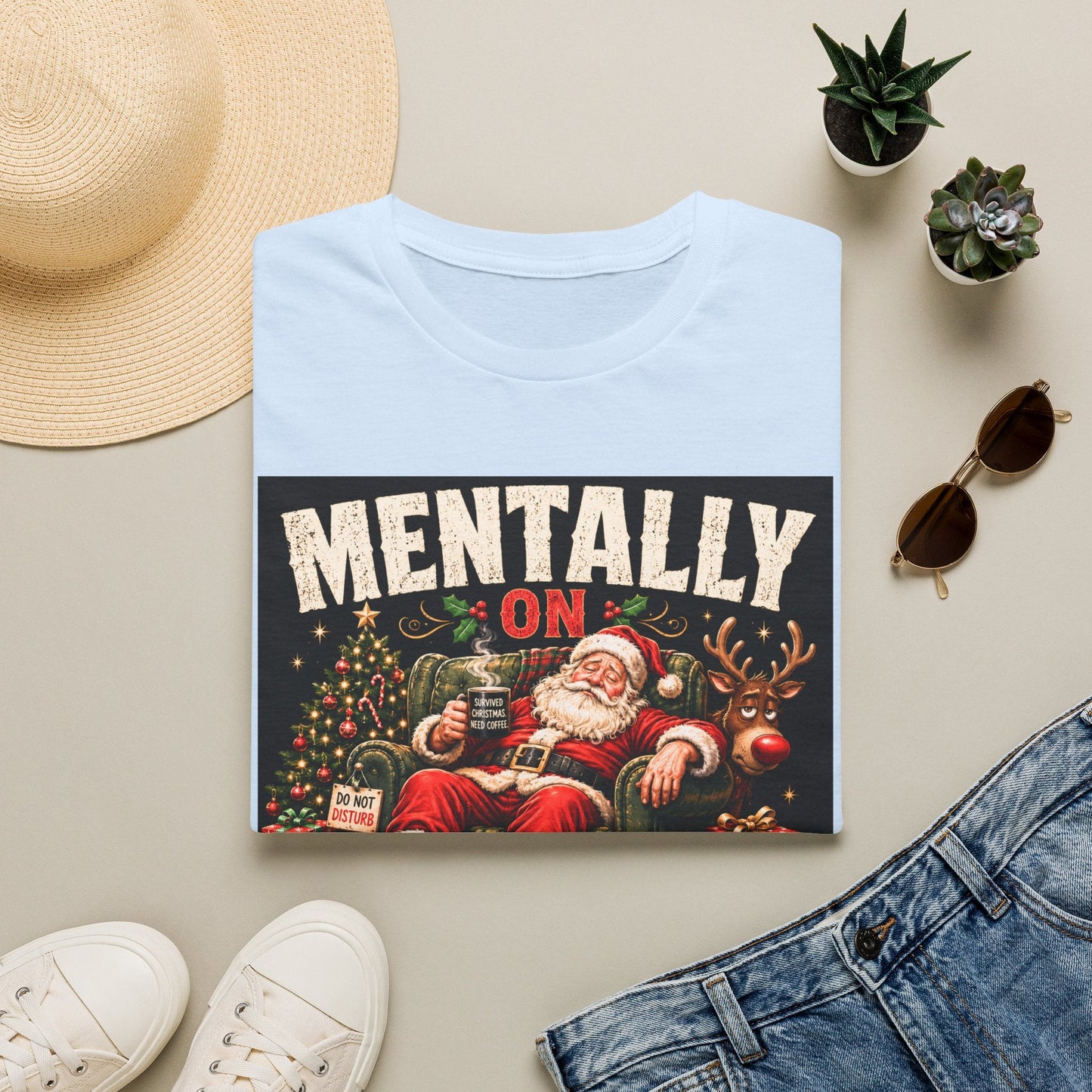 Folded Mentally on Boxing Day Santa Christmas T-Shirt in light blue, showing funny Christmas burnout graphic.
