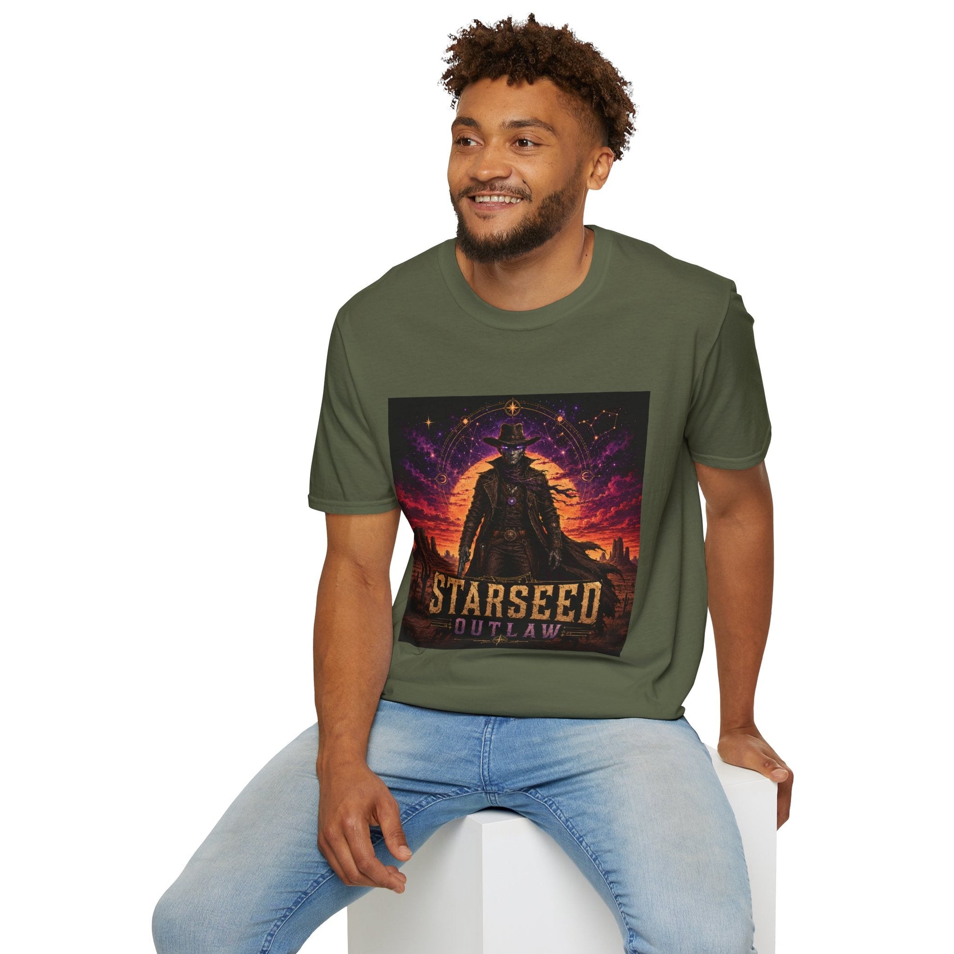 Model wearing Starseed Outlaw graphic T-shirt in military green with sci-fi alien outlaw design.