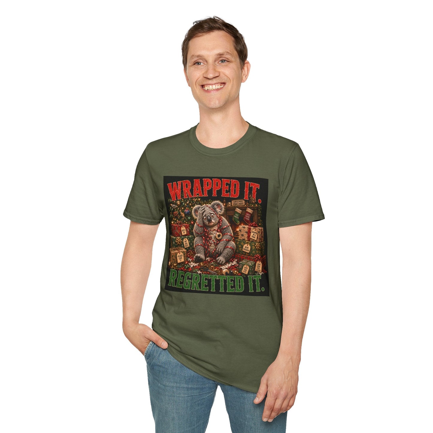 Model wearing the Wrapped It. Regretted It. Koala Christmas T-Shirt in military green with funny festive koala artwork.