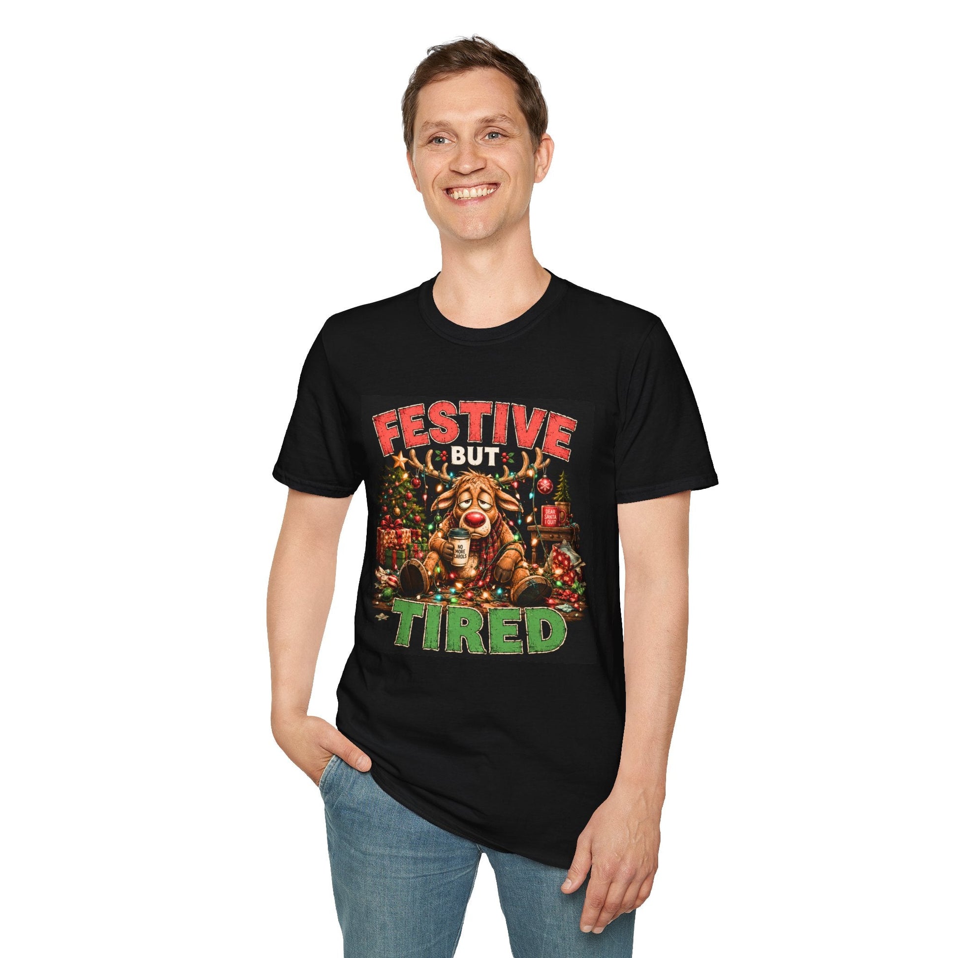Model wearing the Festive But Tired Reindeer Christmas T-Shirt in black with funny tired reindeer artwork.