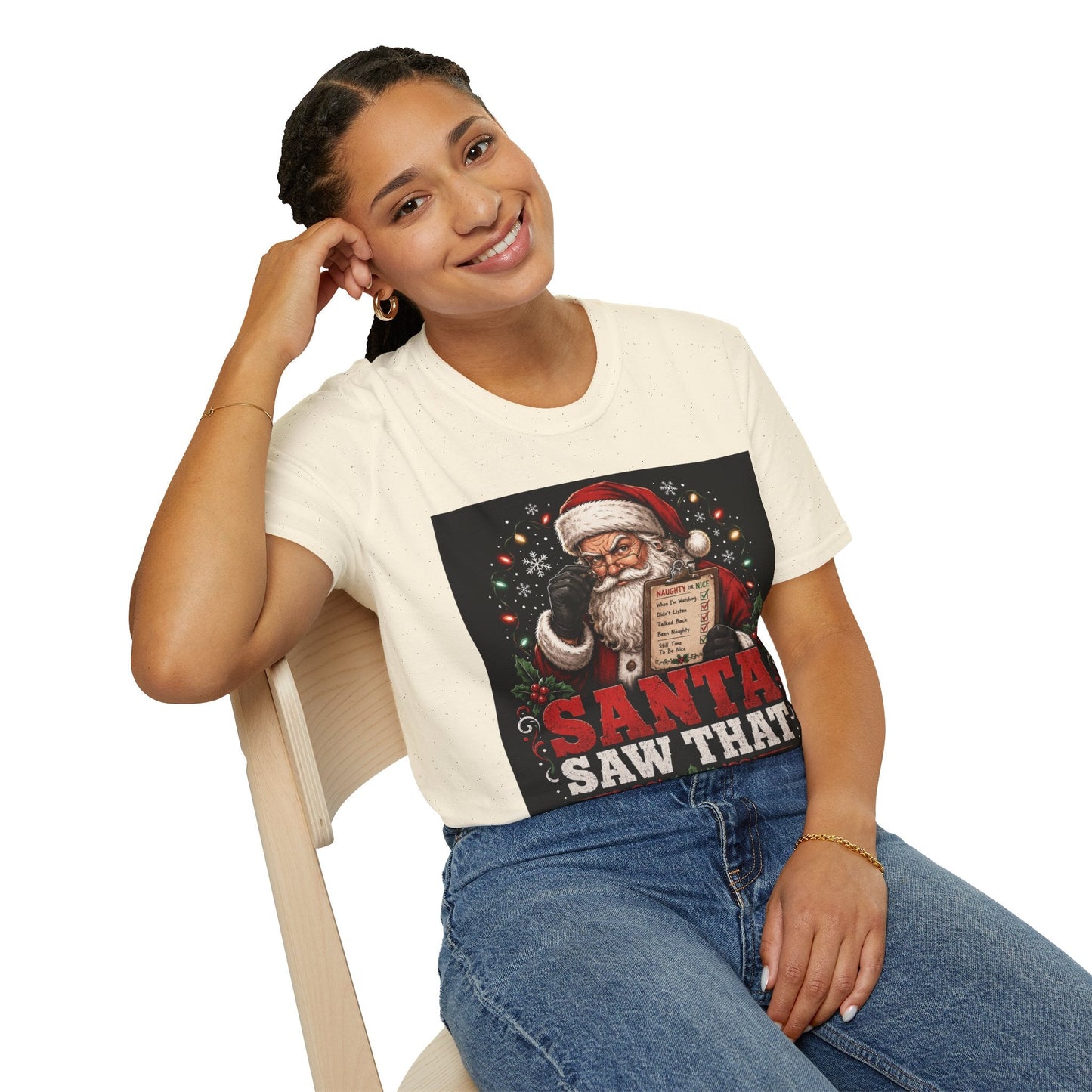 Model wearing the Santa Saw That Christmas T-Shirt in natural with funny Santa naughty list artwork.