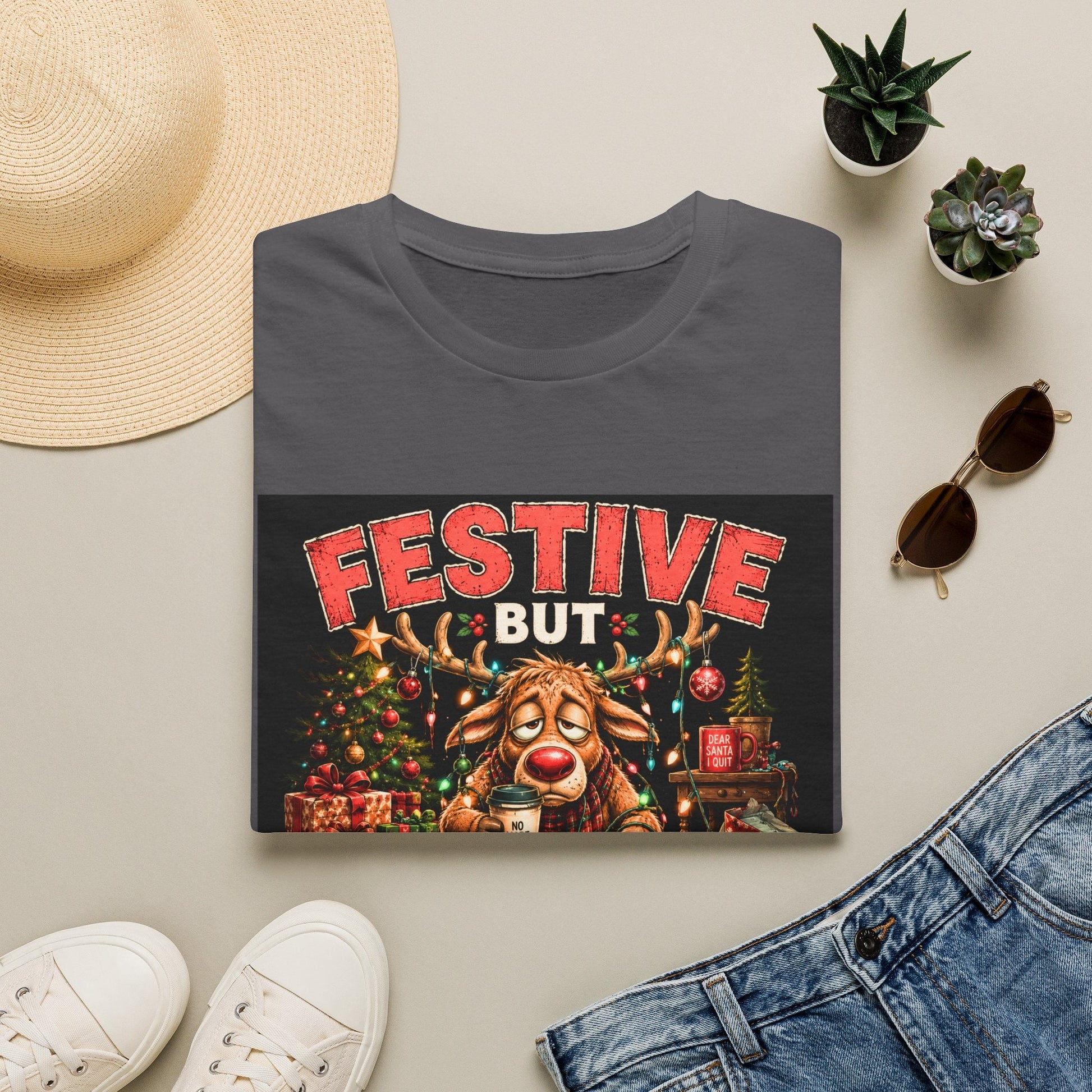 Folded Festive But Tired Reindeer Christmas T-Shirt in charcoal showing funny Christmas reindeer design.