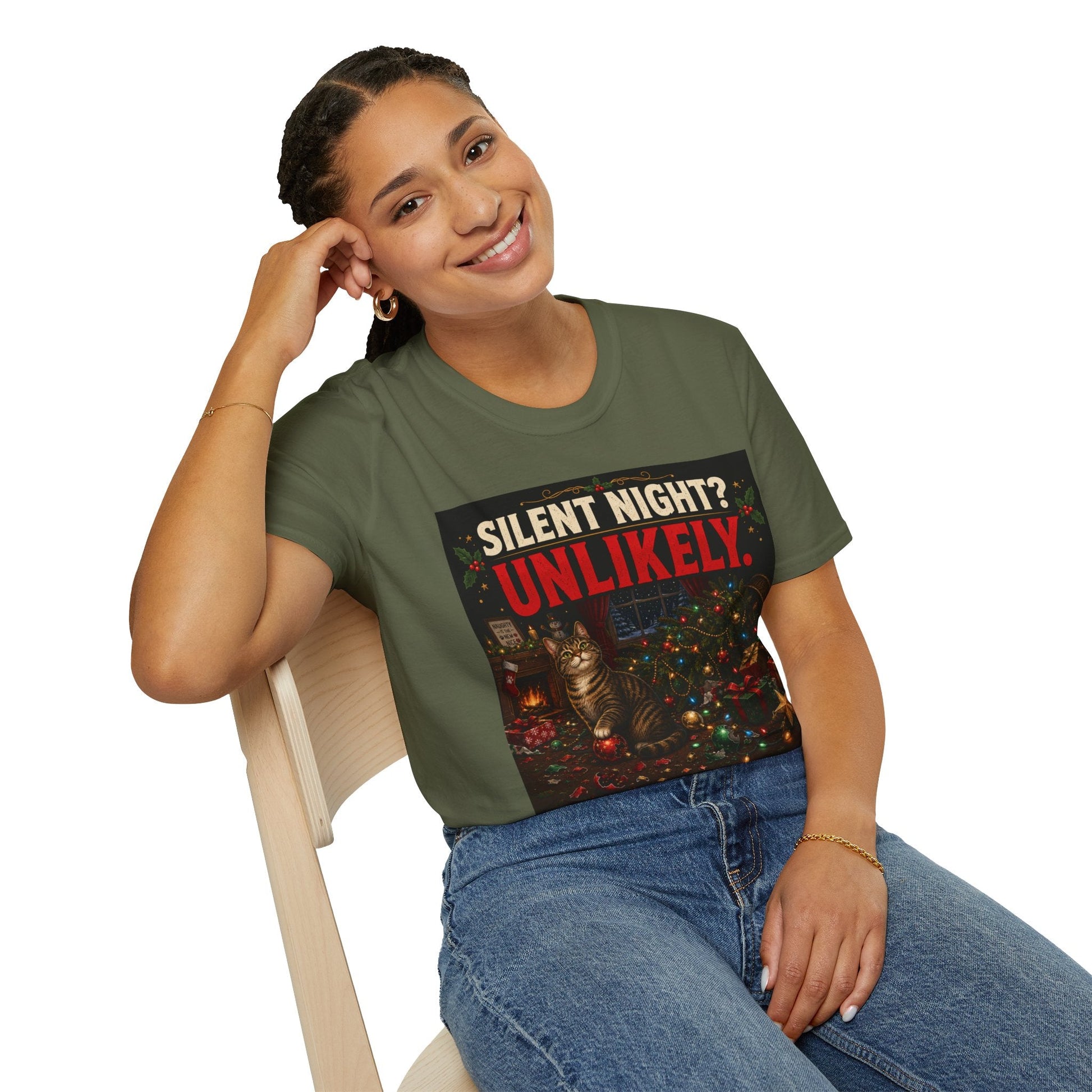 Model wearing the Silent Night? Unlikely. Cat Christmas T-Shirt in military green with funny destroyed Christmas tree artwork.