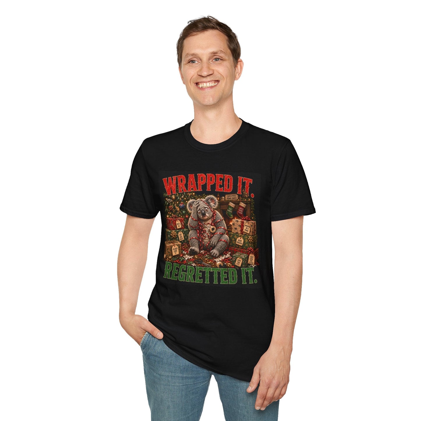 Model wearing the Wrapped It. Regretted It. Koala Christmas T-Shirt in black with funny festive koala artwork.
