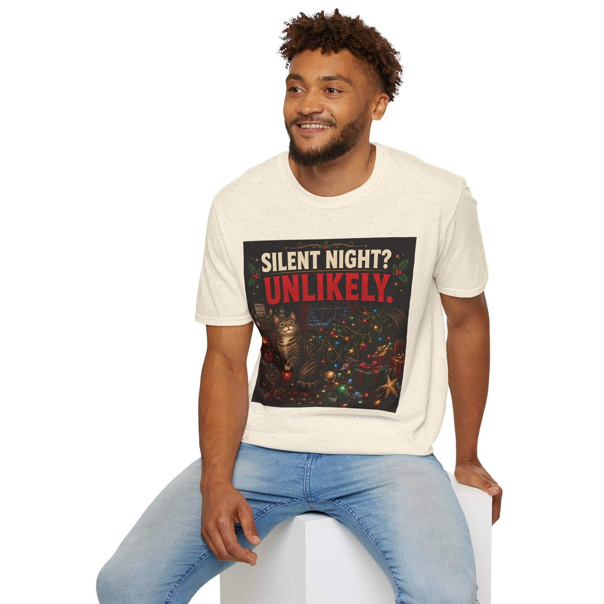 Model wearing the Silent Night? Unlikely. Cat Christmas T-Shirt in natural with funny destroyed Christmas tree artwork.