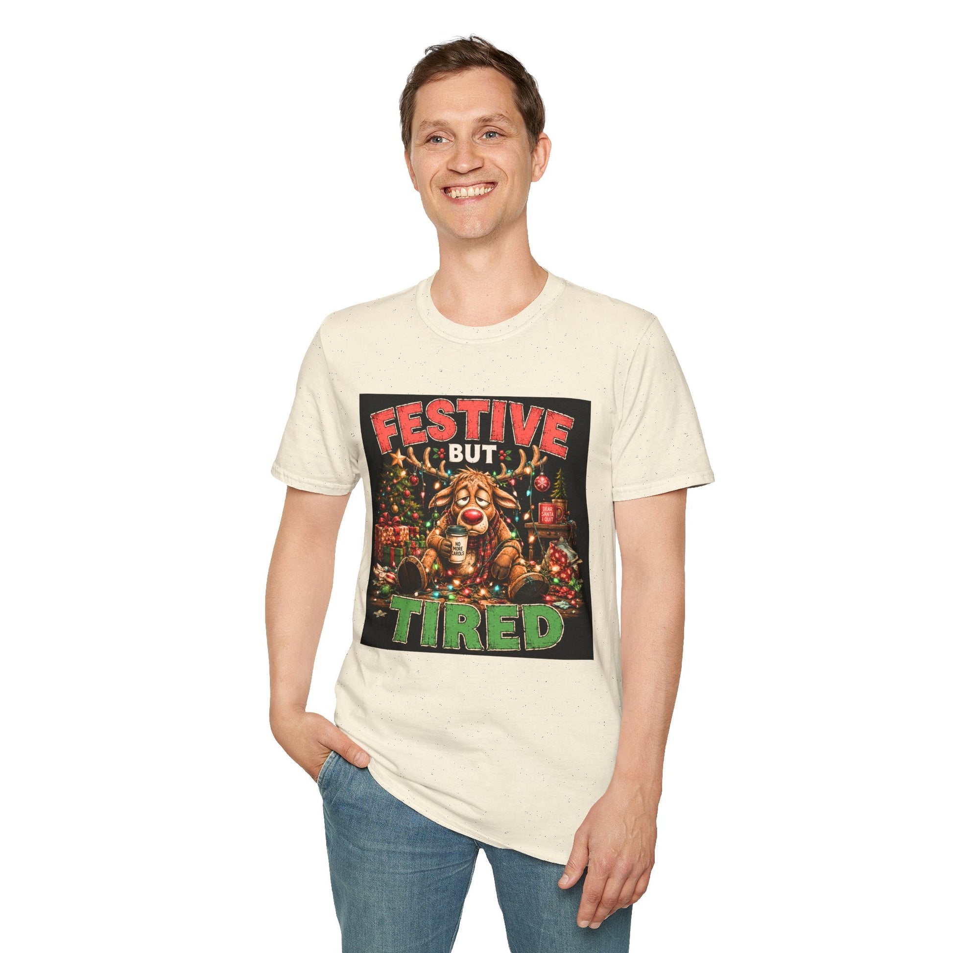 Model wearing the Festive But Tired Reindeer Christmas T-Shirt in natural with funny tired reindeer artwork.