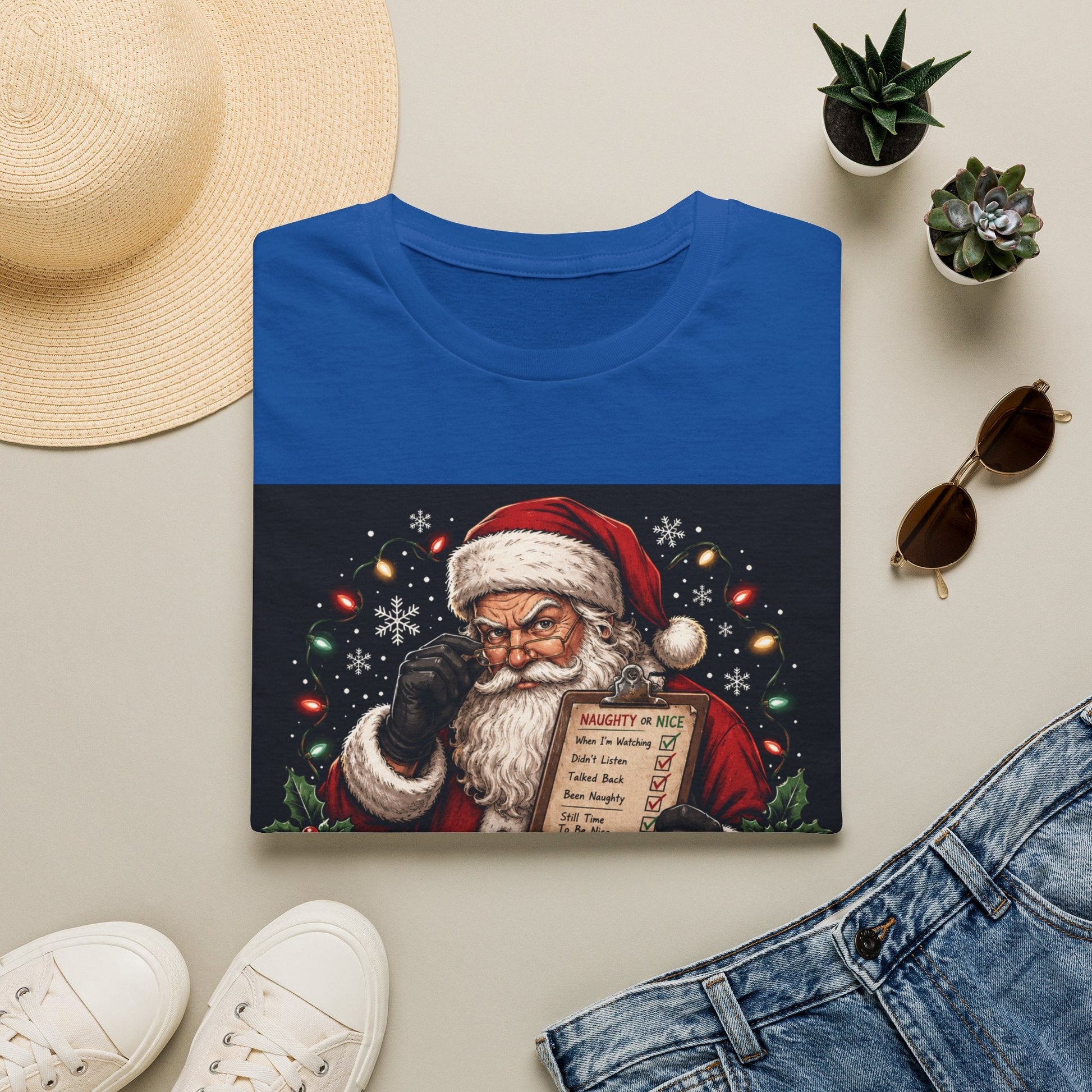 Folded Santa Saw That Christmas T-Shirt in royal showing bold funny Santa Christmas design.