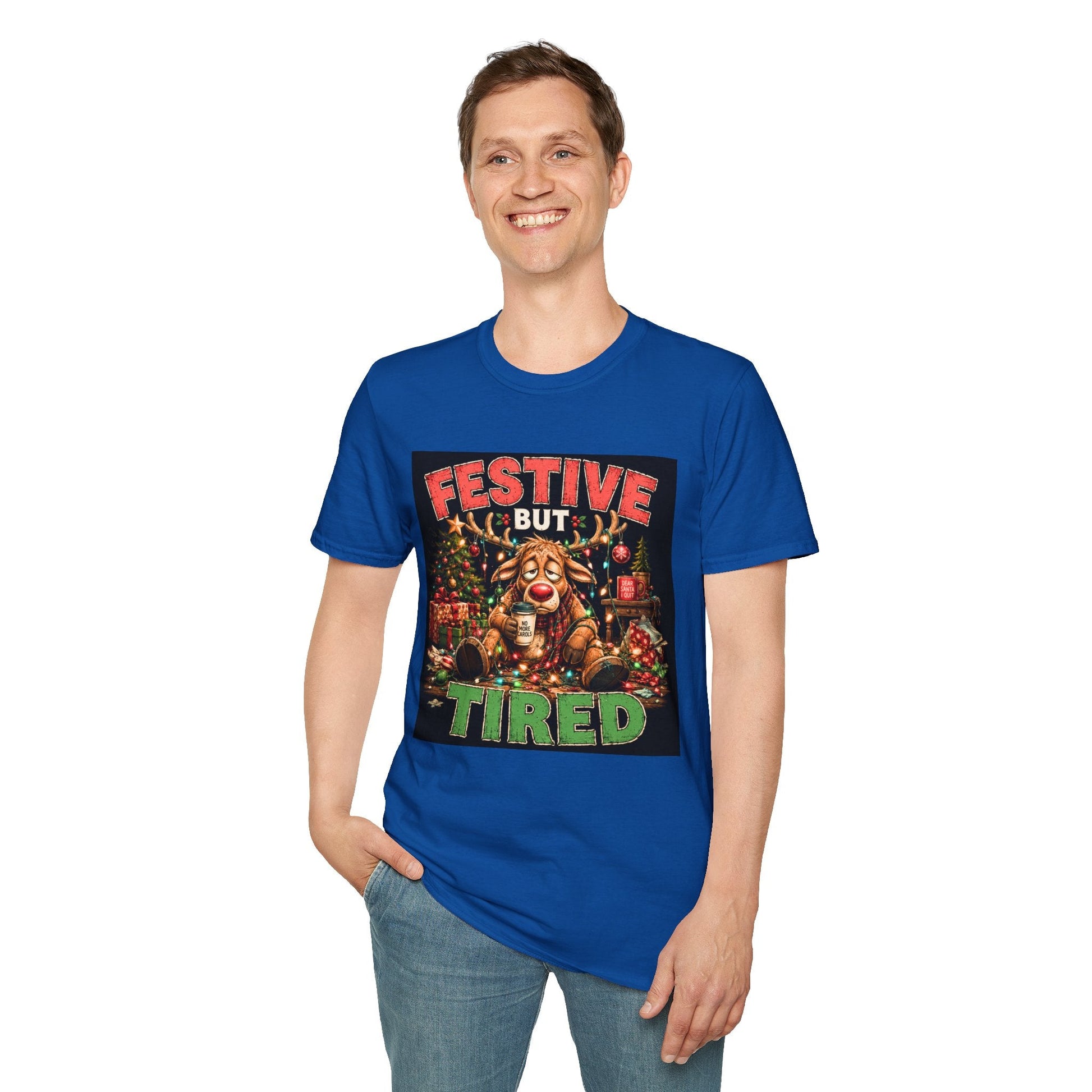Model wearing the Festive But Tired Reindeer Christmas T-Shirt in royal with funny tired reindeer artwork.
