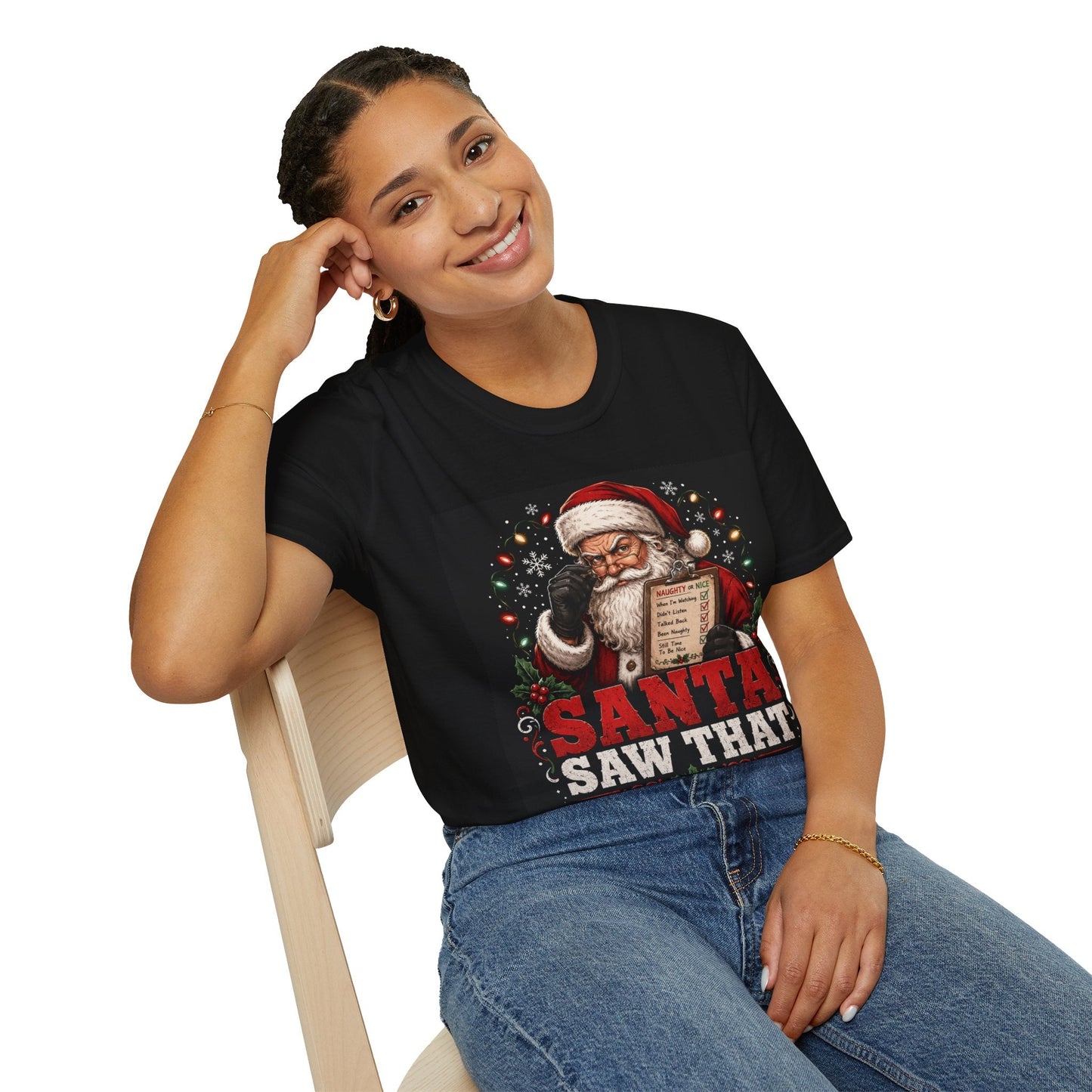 Model wearing the Santa Saw That Christmas T-Shirt in black with funny Santa naughty list artwork.