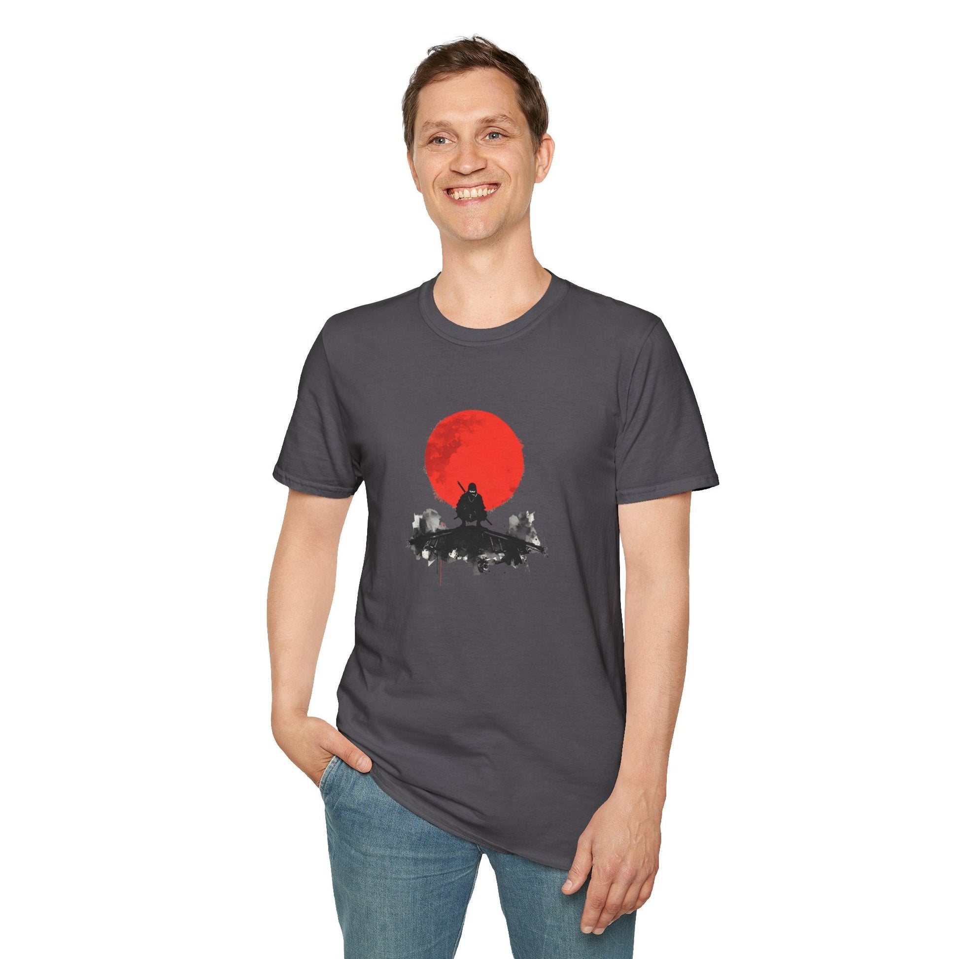 Model wearing the Silent Watch Ninja Beneath the Crimson Moon T-Shirt in charcoal featuring a dark ninja silhouette beneath a bold crimson moon.