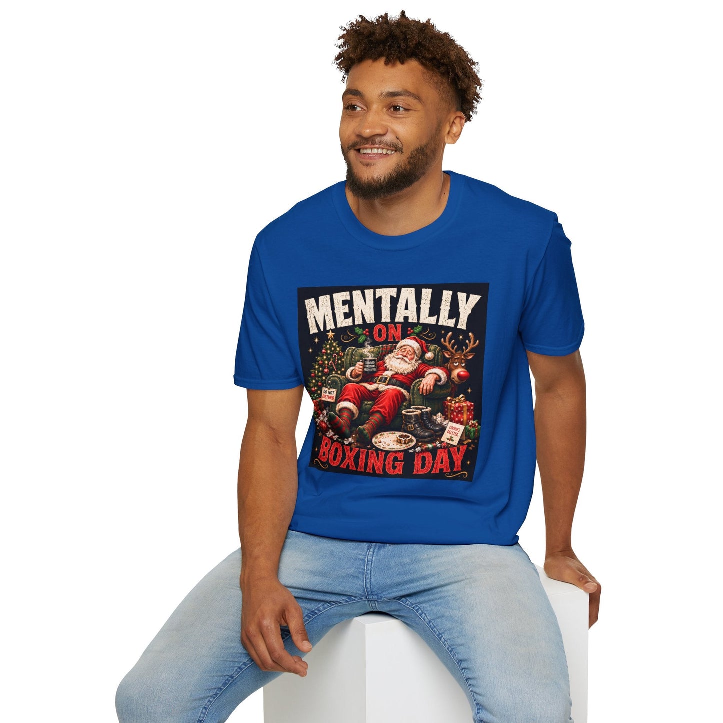 Model wearing the Mentally on Boxing Day Santa Christmas T-Shirt in royal with funny exhausted Santa artwork.