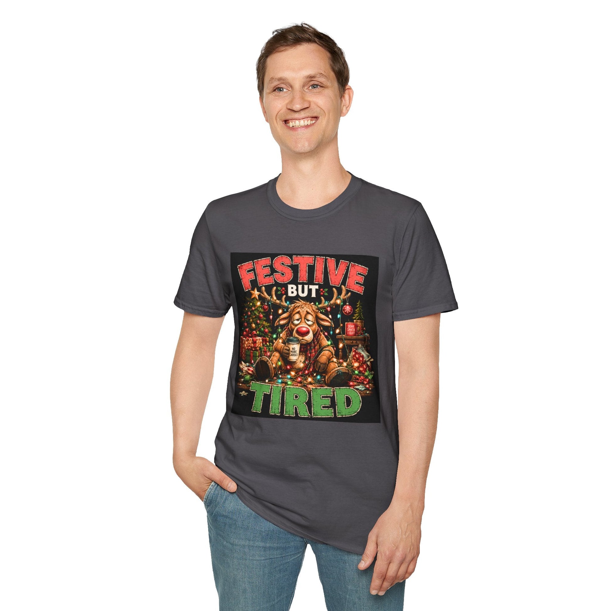 Model wearing the Festive But Tired Reindeer Christmas T-Shirt in charcoal with funny tired reindeer artwork.