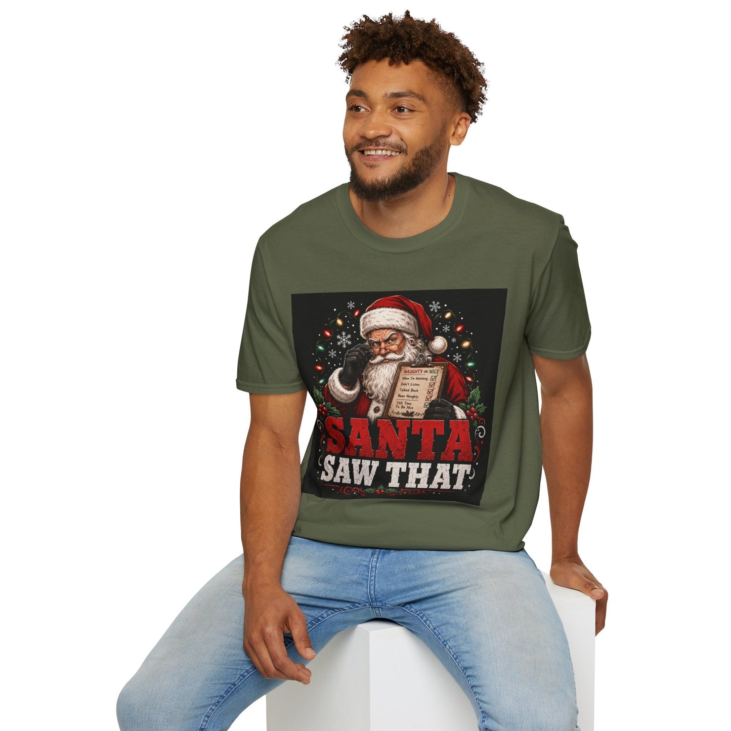 Model wearing the Santa Saw That Christmas T-Shirt in military green with funny Santa naughty list artwork.