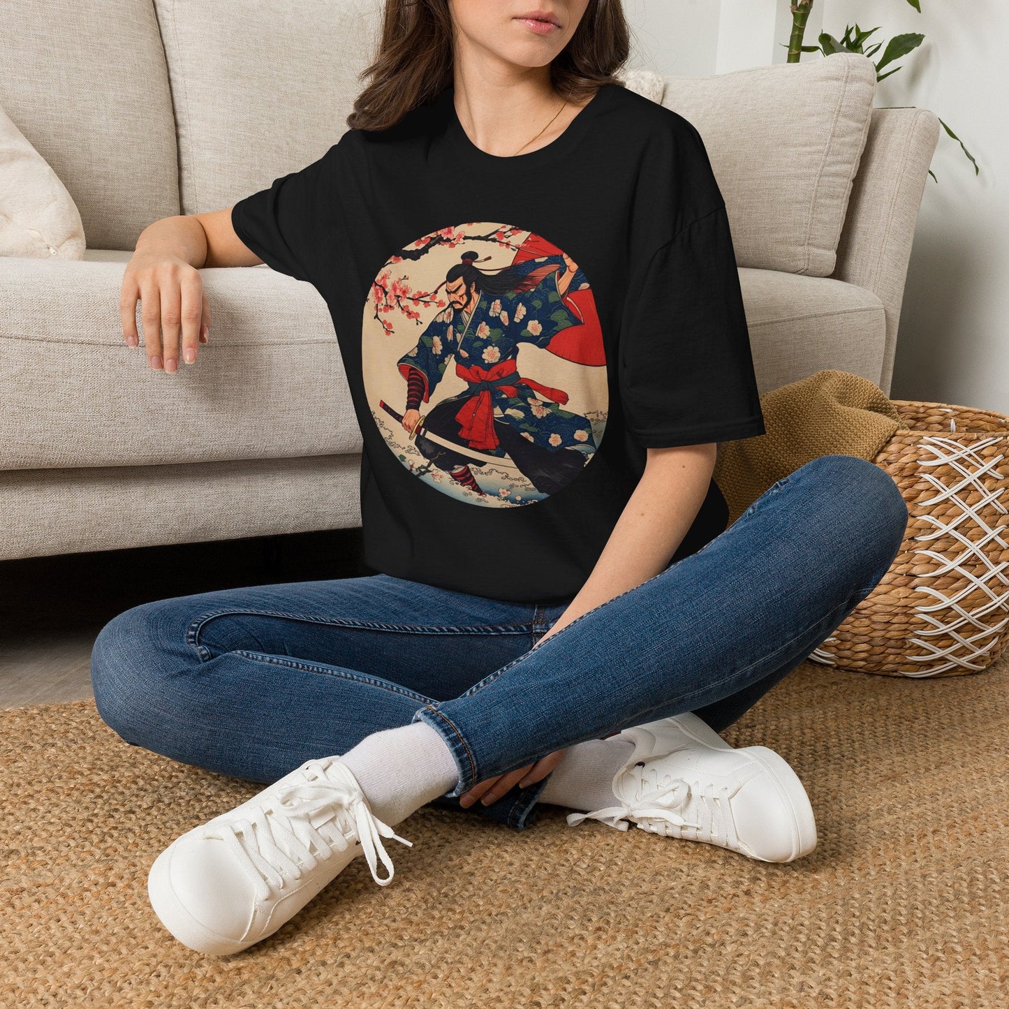 Model wearing the Crimson Bloom Ronin Samurai Warrior T-Shirt in black featuring a Japanese-inspired samurai in motion with cherry blossoms and crimson accents.