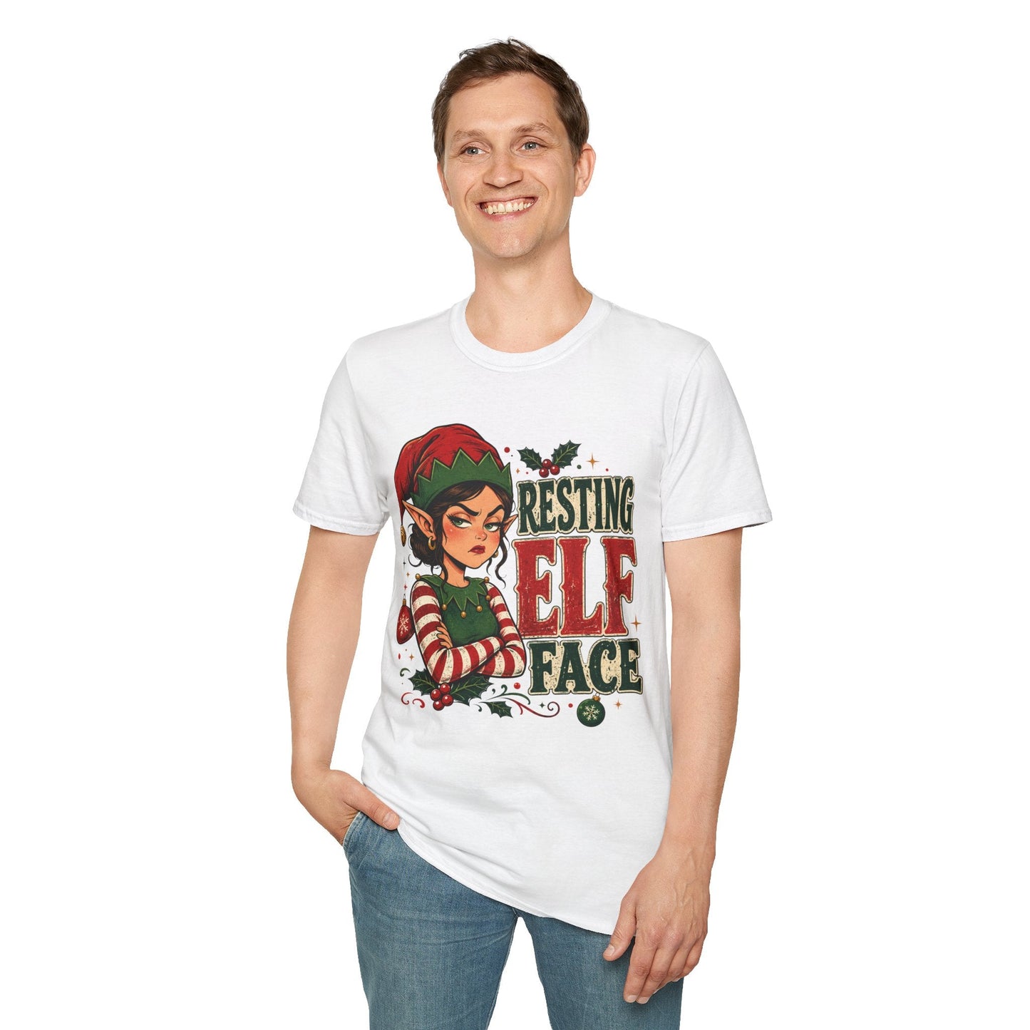 Model wearing the Resting Elf Face Sassy Elf Christmas T-Shirt in white with funny Christmas elf artwork.