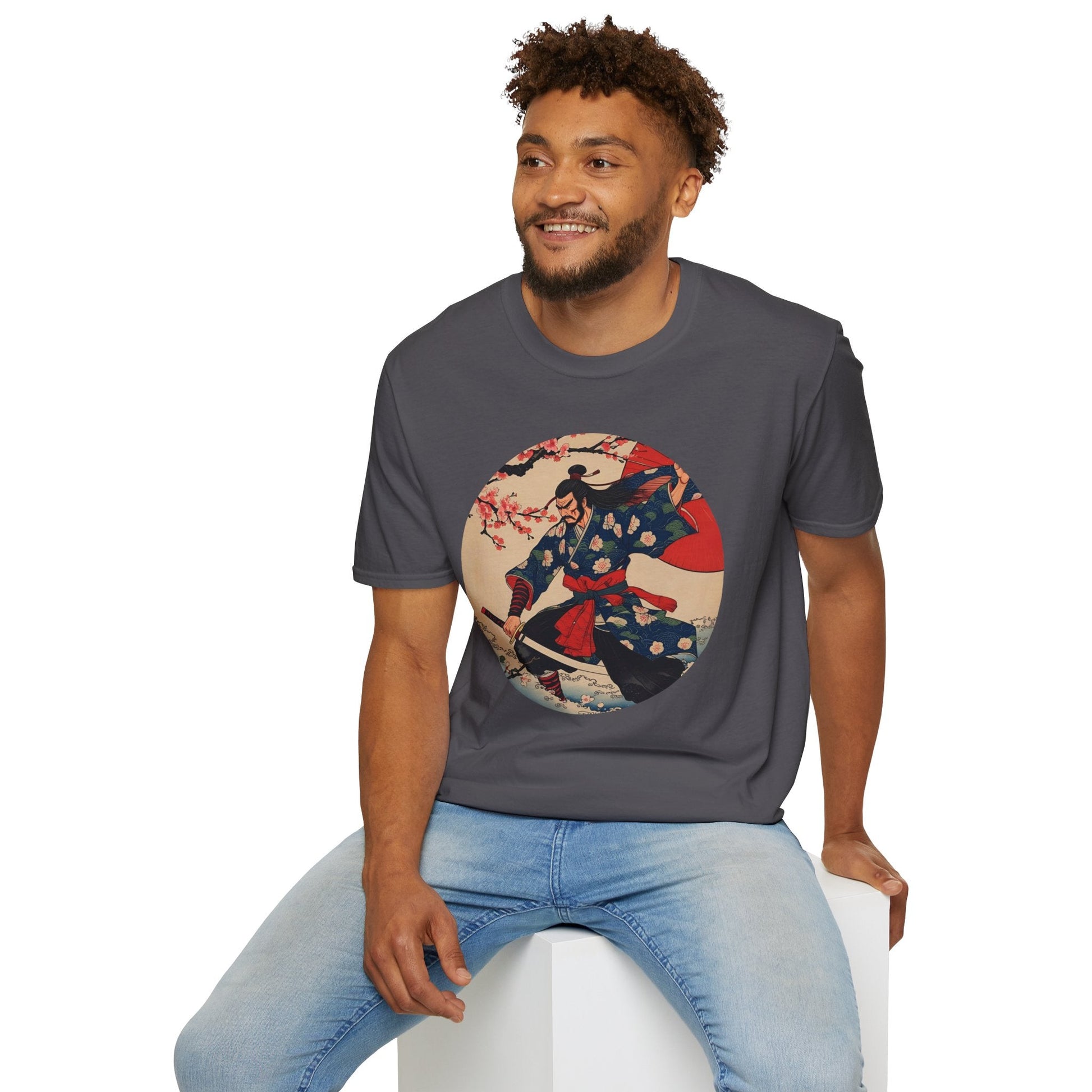 Model wearing the Crimson Bloom Ronin Samurai Warrior T-Shirt in charcoal featuring a Japanese-inspired samurai in motion with cherry blossoms and crimson accents.
